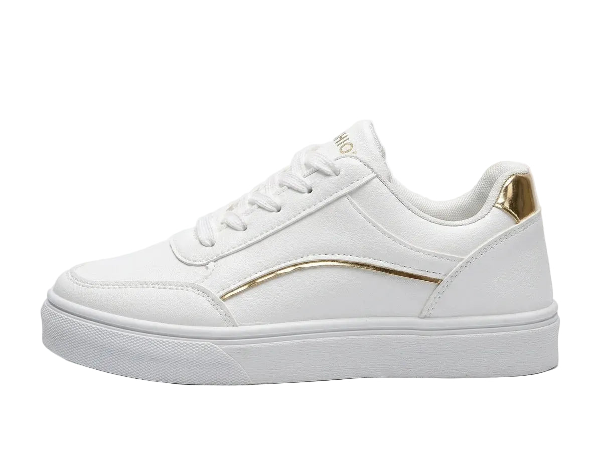 White sneaker with gold accents on a white background